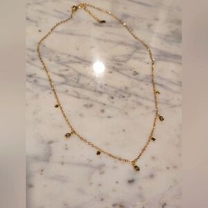Elegant Gold Necklace with Delicate Charms